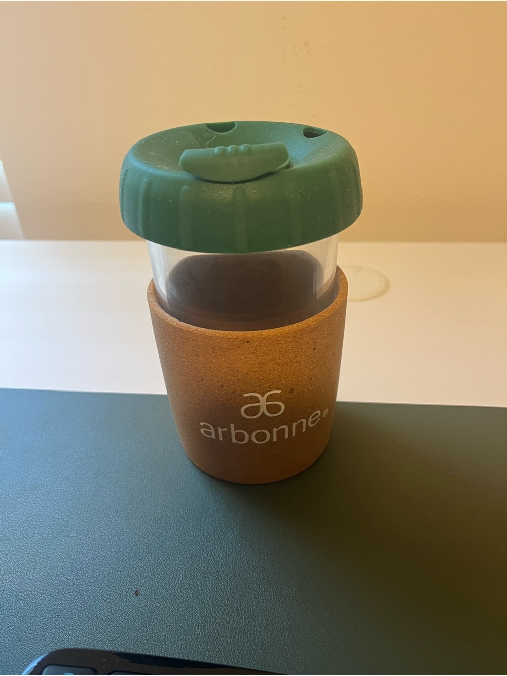 Arbonne Clear Travel Cup with Green Lid and Cork Sleeve